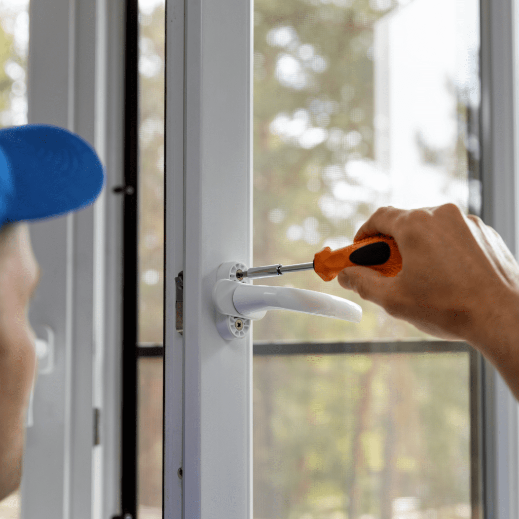 man repairing window